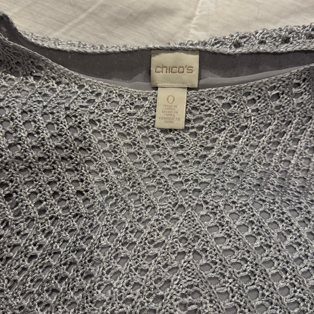 Size 0 short sleeve fully lined silver with sparkly treads incorporated. Chicos